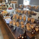 A buffet of desserts and snacks on a table.