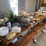 A buffet is set up in a conference room.