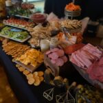 A buffet table with a variety of foods on it.