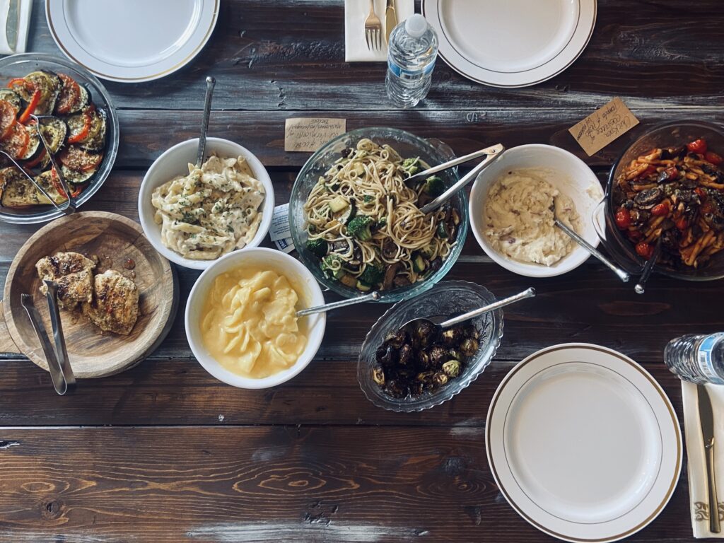 A table full of Wedding Tastings and bowls of food.