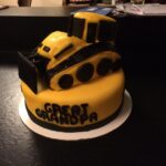 A cake with a bulldozer on it.