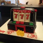 A cake with a slot machine on it.