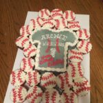 A cake decorated with baseball t - shirts.