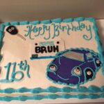 A birthday cake with a car on it.