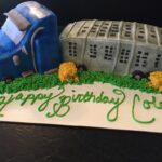 A cake with a tractor and a truck on it.