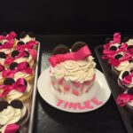 Minnie mouse cupcakes with pink bows.