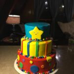 A colorful cake with a star on top.