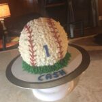 A baseball cake with the number 1 on it.