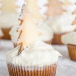 Cupcakes with icing and a tree on top.