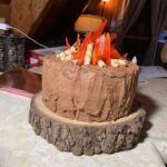 A chocolate cake sitting on top of a wooden board.