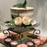 A cake stand with cupcakes and cupcakes on it.