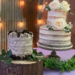 Two wedding cakes sitting on top of a table.