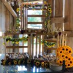 A wooden crate with sunflowers on it.