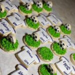 Soccer themed cookies with soccer balls and t shirts.