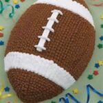 A knitted football with confetti and confetti.