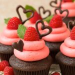 Valentine's day cupcakes with raspberries and chocolate.