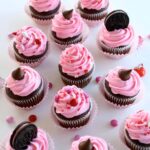 Valentine's day cupcakes with pink frosting and oreos.