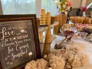 A table with food and a sign.