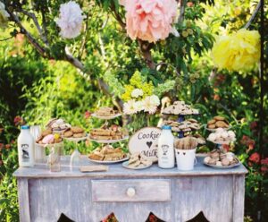 A table with cookies and milk.