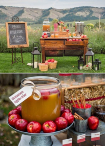 An apple cider bar with jars of apples and jars of cider.