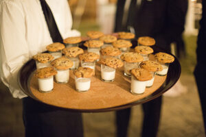 A tray of cookies and milk.