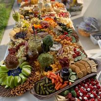 A long table with a lot of food on it.